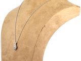 a close up of a mannequin with a necklace on it ' s neck