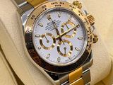 a rolex watch in a box with a watch in it