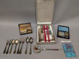 a box of silverware and a case of silverware