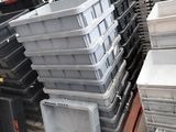 a lot of plastic containers stacked on top of each other