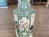 a vase that is sitting on a table in a room