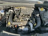 a picture of a car engine with its hood open