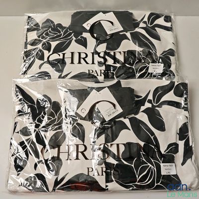 two black and white sheets with black and white flowers on them