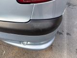 a close up of a car ' s rear bumper with a cat on it
