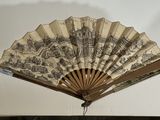 a fan that is hanging on the wall