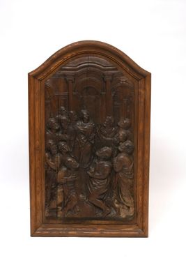 an old wooden plaque with an image of a group of people on it