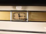 a clock that is on the front of a car