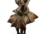 bronze statue of a young ballerina holding a bird on a pedestal