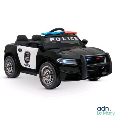 a toy police car that is sitting on a white surface