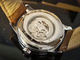 a close up of a watch on a table