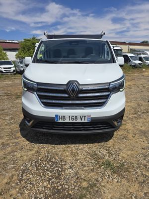 the front of a white van parked in a parking lot