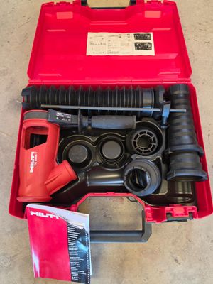 a red tool box with tools in it on the floor