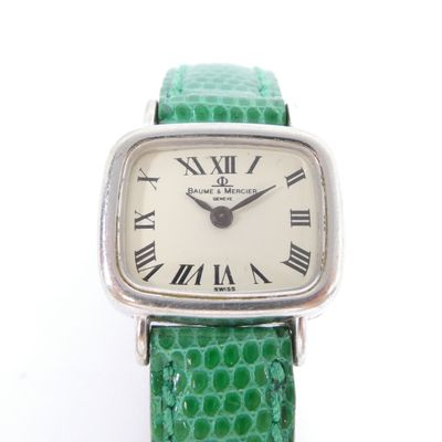 an image of a close up of a wrist watch with roman numerals on it