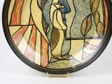 a plate with a painting of a woman on it