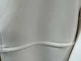 a close up of a person wearing a white jacket