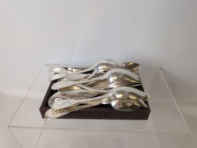 a display of silverware in a clear box