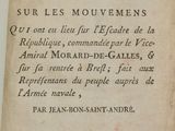 un vieux livre écrit posé sur une table