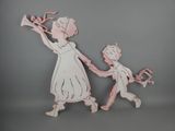 a wooden cutout of a couple holding hands