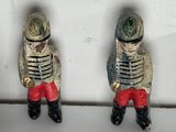 two figurines of a soldier on a shelf