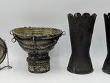 three vases that are sitting next to each other on a table