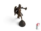 an image of a bronze statue of an angel with a trumpet