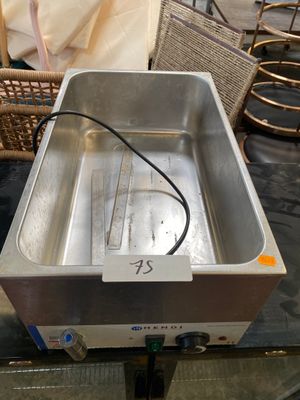 a metal pan that is sitting on top of a table