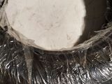 a tire that has been wrapped in plastic to protect it from the sun