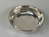 an image of a silver plate on a white surface