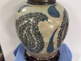 a vase that is sitting on top of a blue cloth