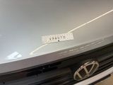 a sticker on the hood of a silver car