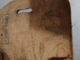 a small wooden object with a hole in the middle of it