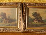 two framed paintings of a farm scene with a windmill and a house