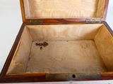 a small wooden box with a key inside of it