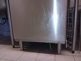 a large stainless steel dishwasher in a kitchen