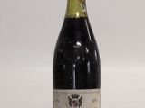 a bottle of wine that is sitting on a table