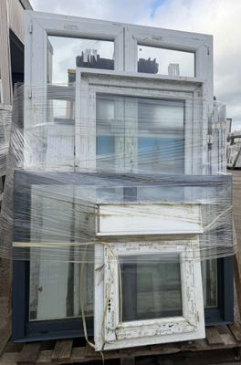 a picture of a house with a lot of windows wrapped in plastic