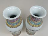 two vases that are sitting on a table