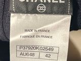 a close up of a chanel label on a sweater