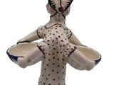 a figurine of a woman holding a bowl in her hands