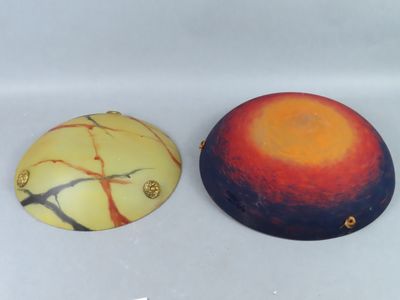 two decorative items that are sitting on a table