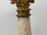 an image of a close up of a pillar with a marble top