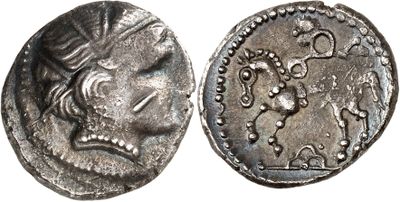 a silver coin with an image of a woman on it