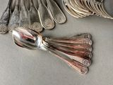 many spoons and spoon spoons sitting on a table