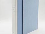 two books sitting side by side on a white surface