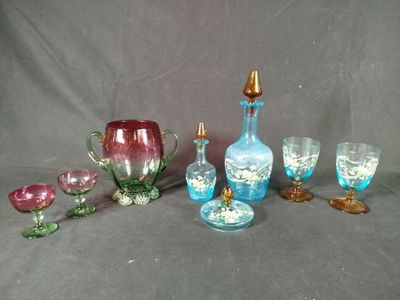 a lot of glass items that are sitting on a table
