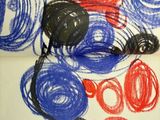 a drawing of red, white and blue circles on a piece of paper