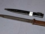 a knife and a knife holder on a table