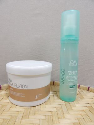 a bottle of lotion and a container of lotion sitting on a table