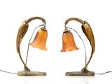 pair of art nouveau style lamps with orange glass flowers on bronze bases