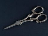 a pair of scissors that are sitting on a table